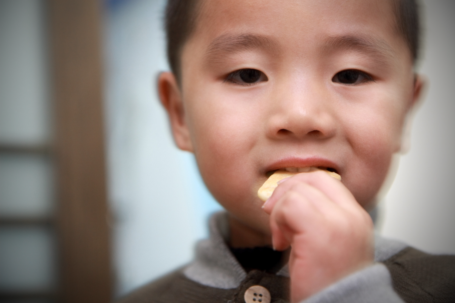 child eating cracker