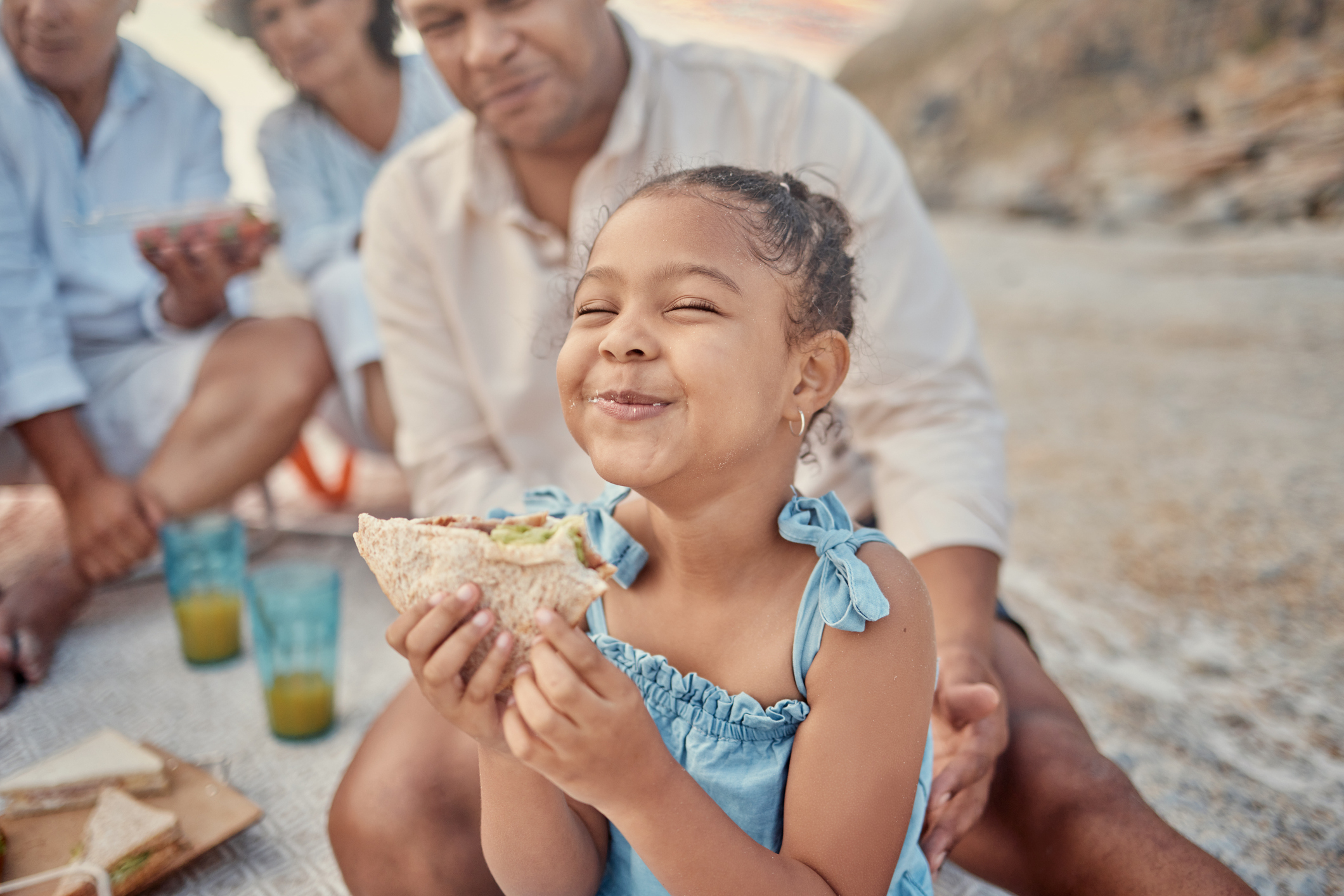 Young girl eating sandwich